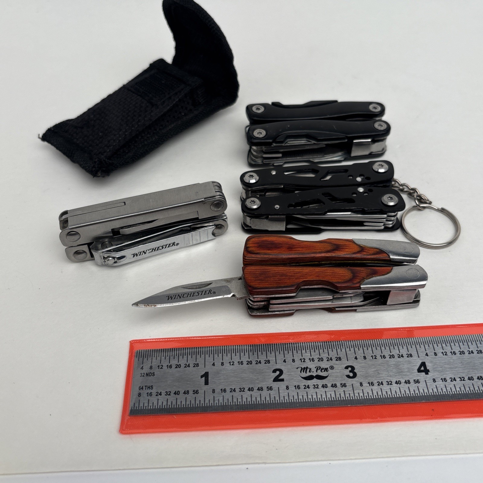 Lot Of 4 Different Function Multi-Tools Winchester Nail Clipper & Wood Grain