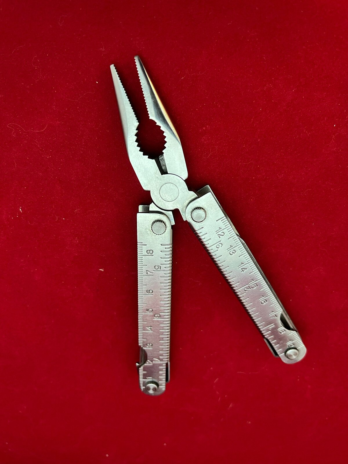 Stainless Steel 12-in-1 Multi-Tool – Pliers Knives Screwdrivers File Saw Opener