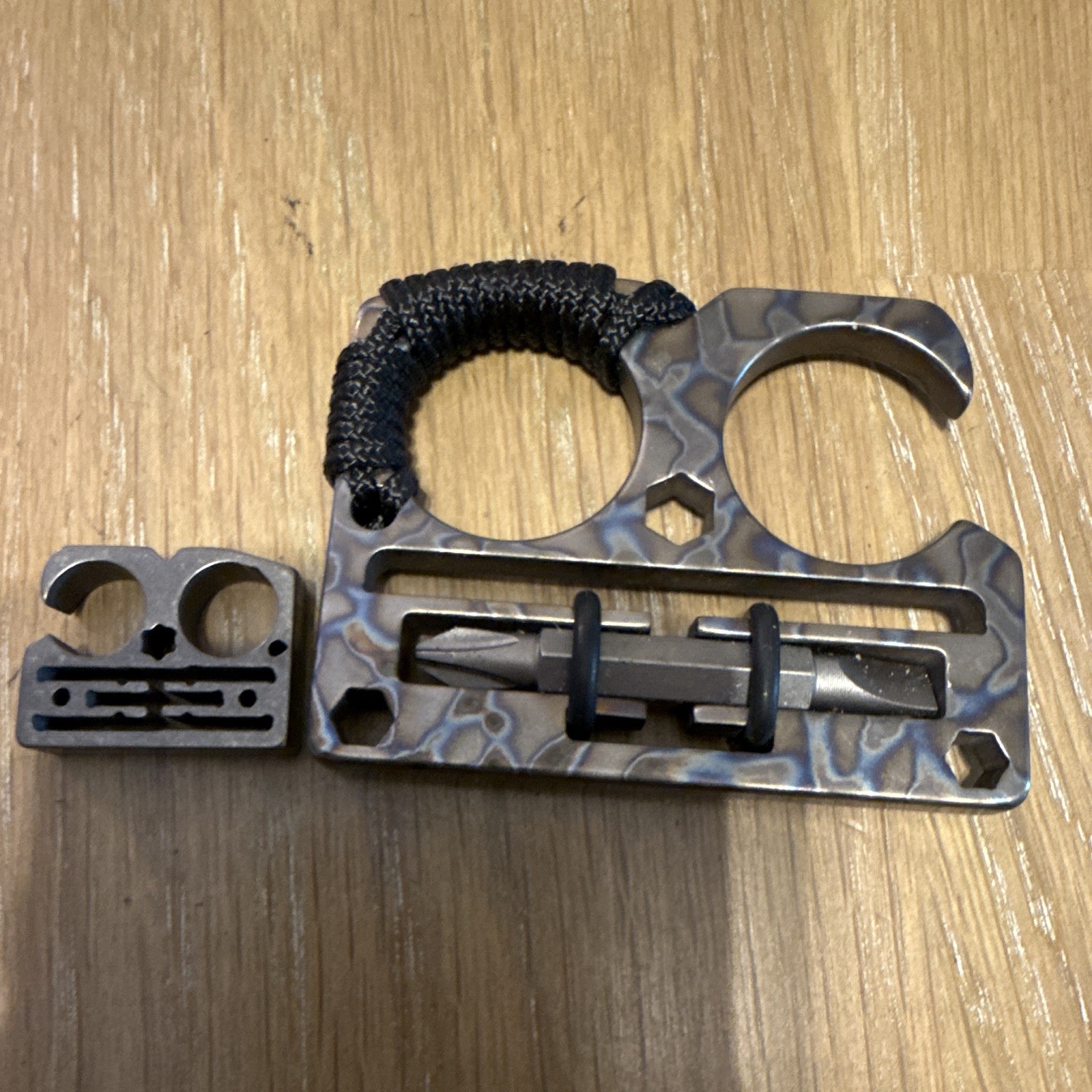 Titanium LockJaw Compact flame-anodized DFK with matching Titanium bead