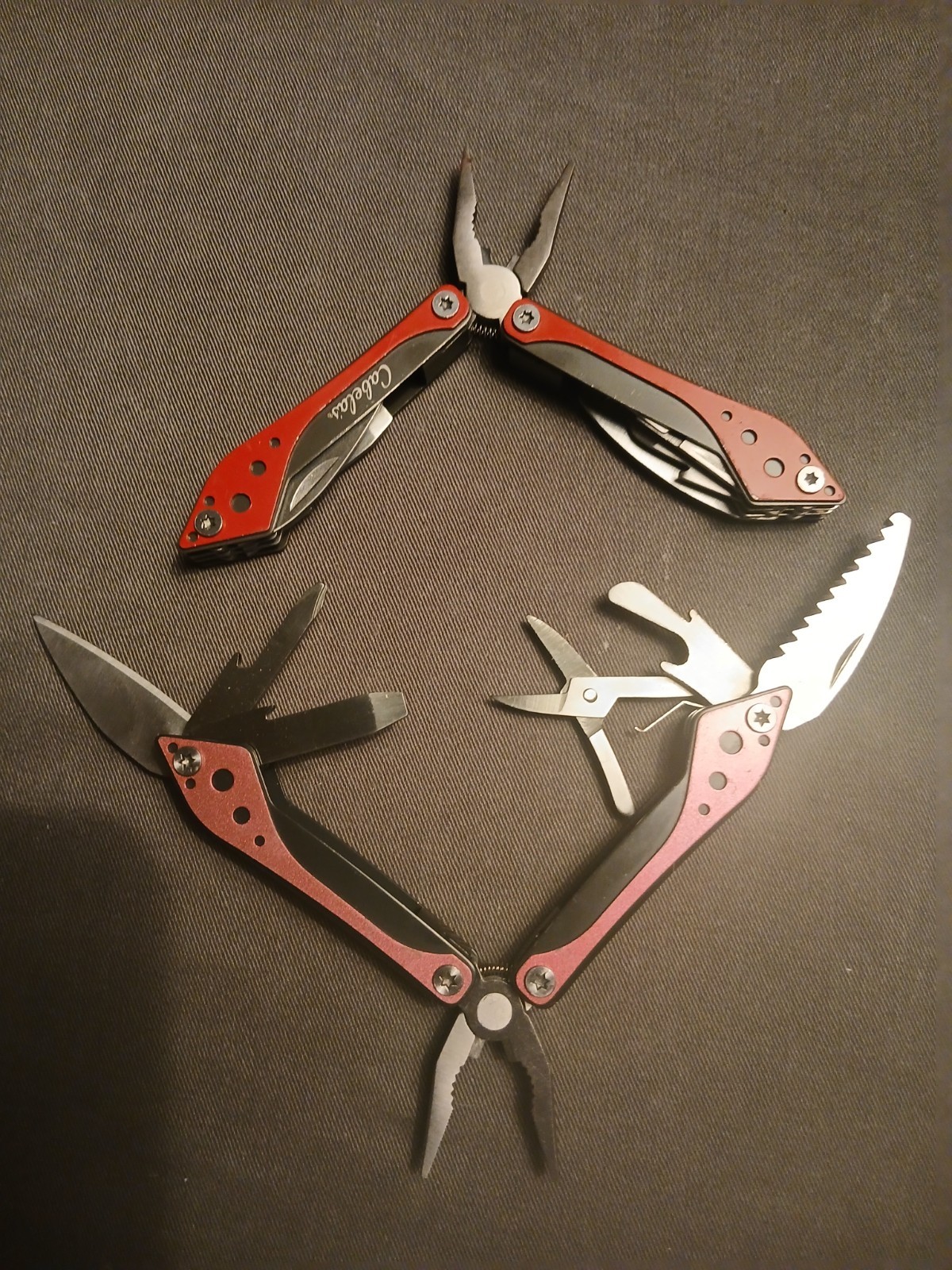 Lot of 2 Cabela’s Multi-Tool 1)Red/ 1) Pink Unused Comes with Cases