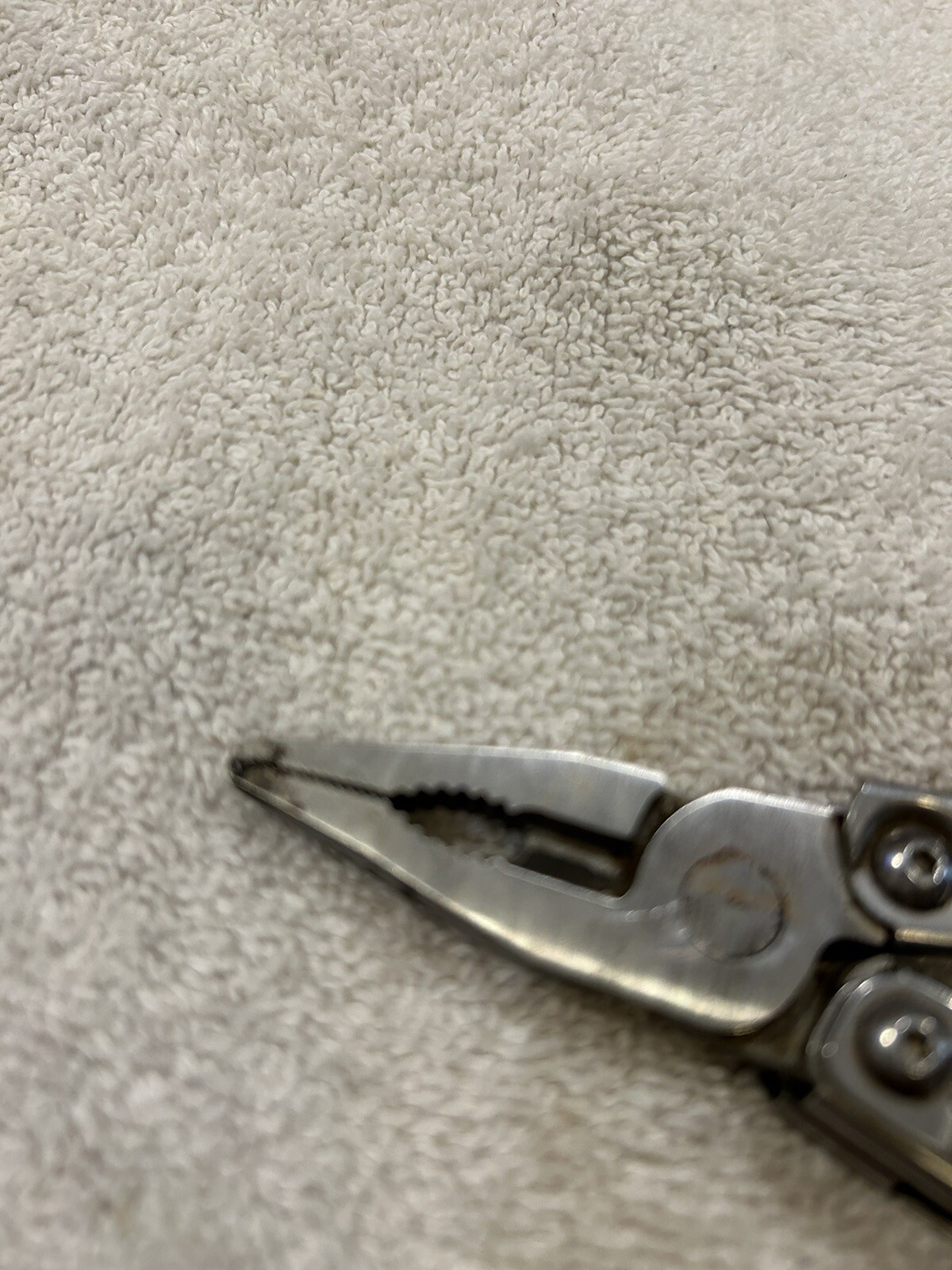 Leatherman Rev multitool with company logo