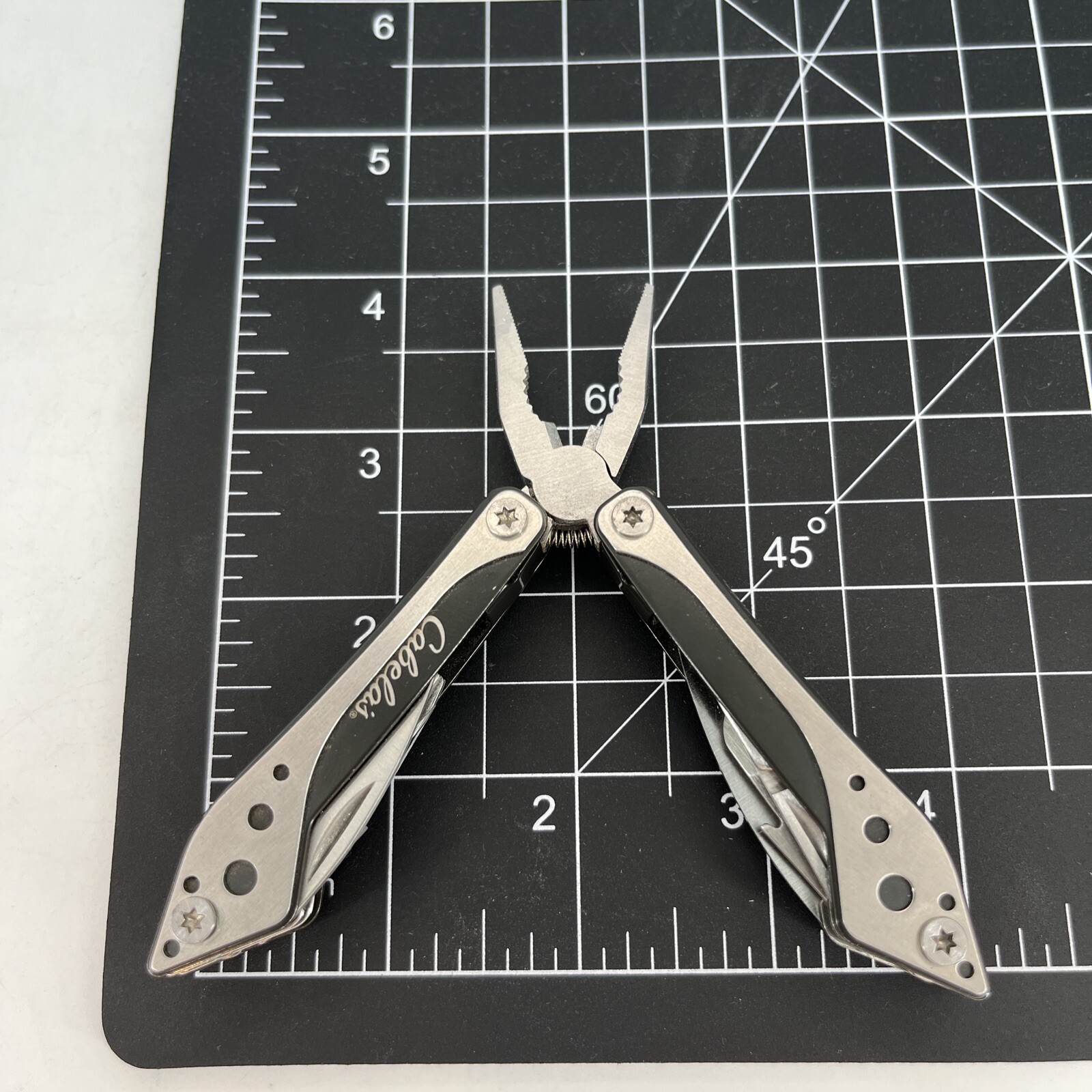 LOT OF 2 Cabela’s SILVER & GREEN Mini Multi-Tool Spring Open Pliers Scissors Saw