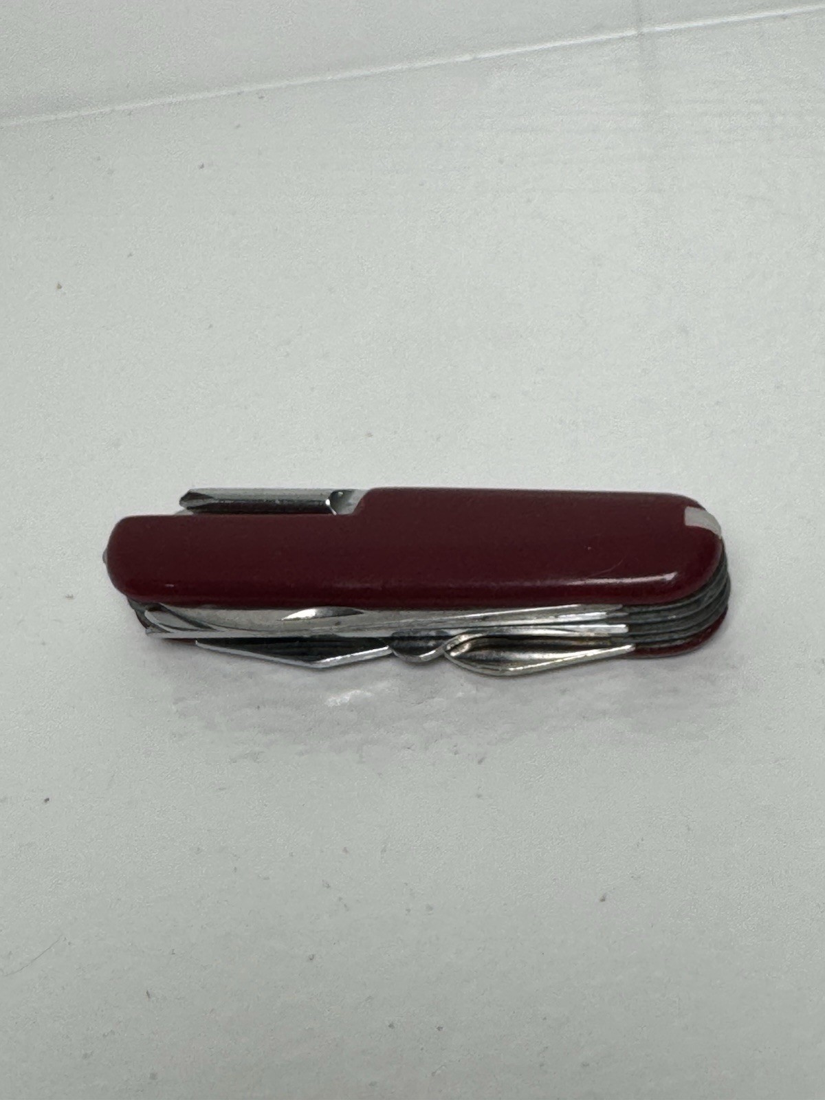 Red Swiss Army Knife With 12 Attachments Including Scissors, Saw, Etc