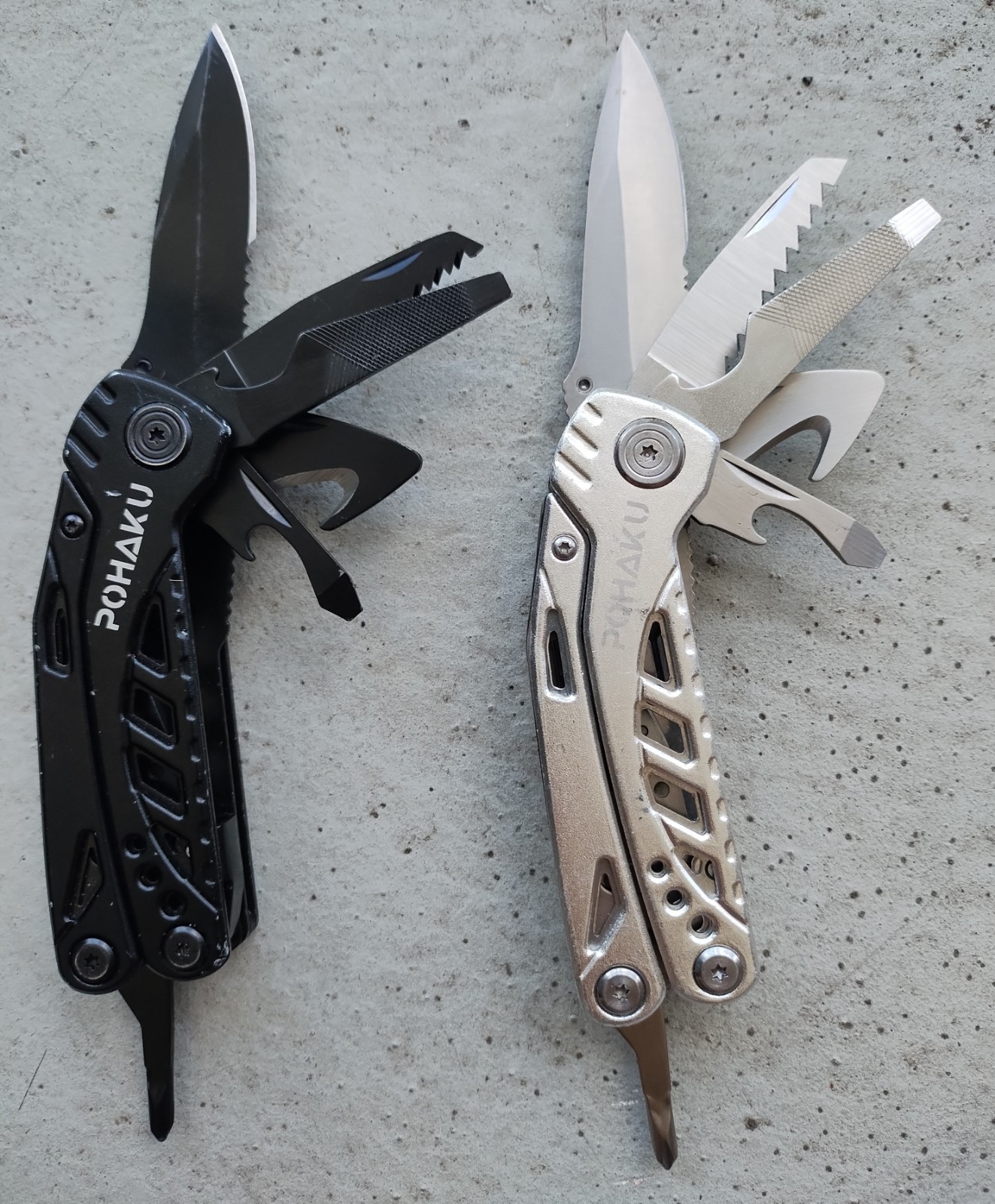 POHAKU BLACK & SILVER MULTI TOOL PLIERS KNIFE, SAW BLADE, FILE, ETC. LOT OF 2