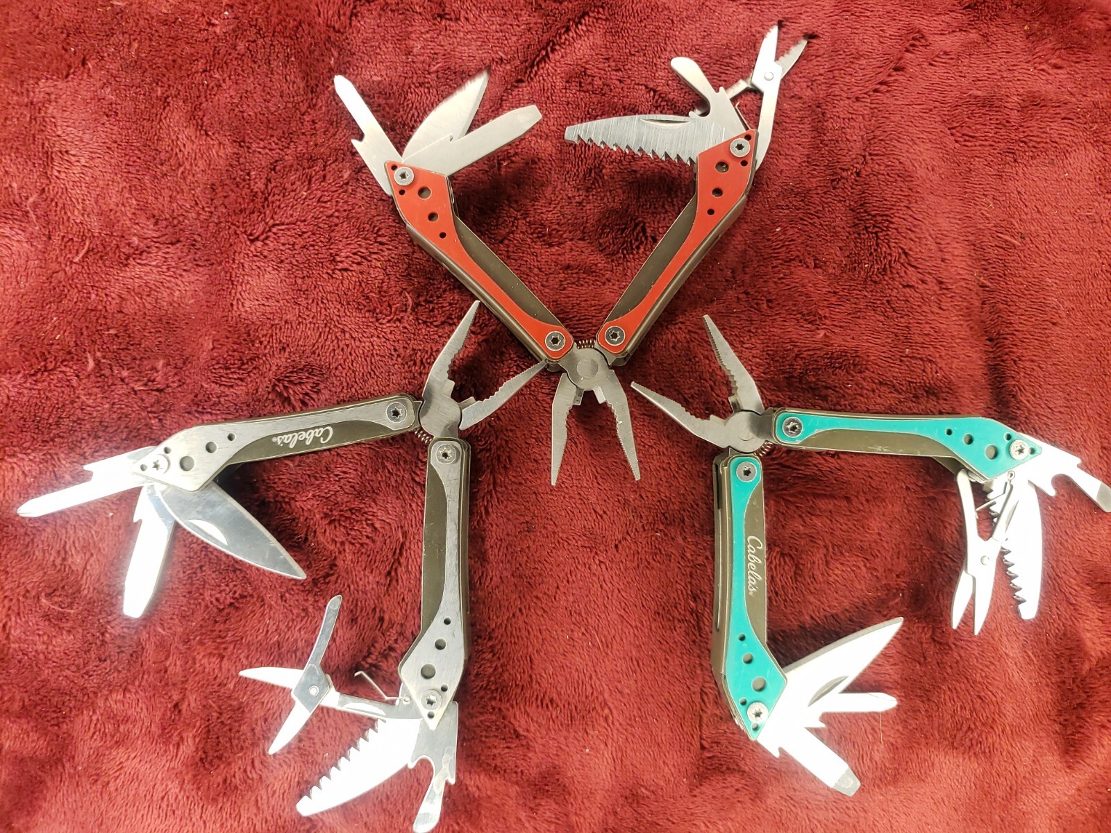 Lot of three Cabela’s Multi Tool Stainless Clear, Teal Green & Red