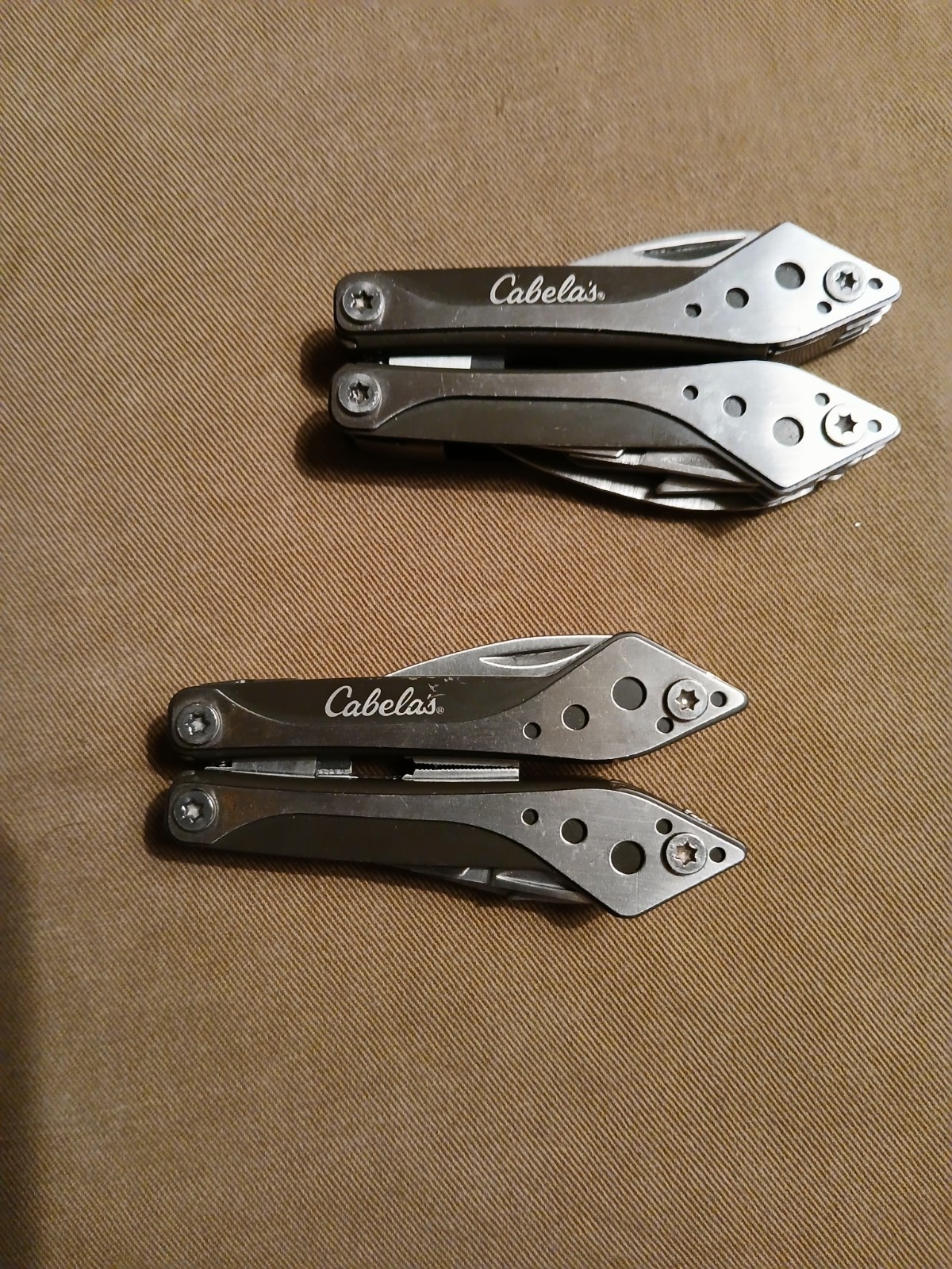 2) Cabela’s Multi-tool with nylon case unused